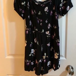Black stretchy Romper , w/ purple floral prints